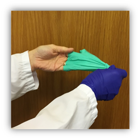The left hand glove is inside out coming off the fingertips while still being pulled by the right hand glove.