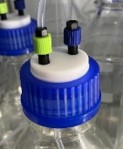 Solvent bottle with a two-port threaded cap 